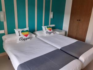 Postel nebo postele na pokoji v ubytování Hotel Clibomar Jamaica