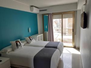 Postel nebo postele na pokoji v ubytování Hotel Clibomar Jamaica