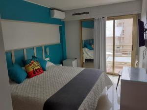 Postel nebo postele na pokoji v ubytování Hotel Clibomar Jamaica