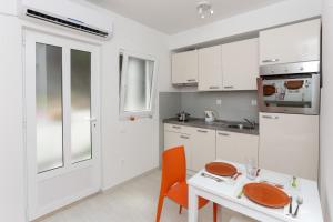 Kuchyň nebo kuchyňský kout v ubytování Apartments Posta