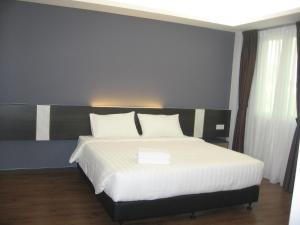 Postel nebo postele na pokoji v ubytování 707 Hotel (Cheng Ho ) Melaka