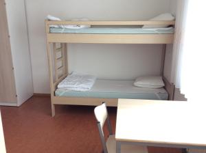 Postel nebo postele na pokoji v ubytování Atelier & Herberge ViDo