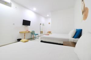 Postelja oz. postelje v sobi nastanitve Locus Rooms