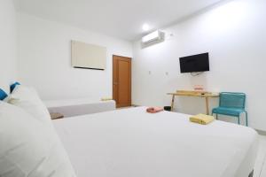 Postelja oz. postelje v sobi nastanitve Locus Rooms