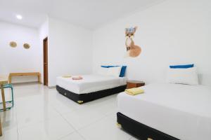 Postelja oz. postelje v sobi nastanitve Locus Rooms