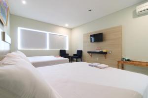 Postelja oz. postelje v sobi nastanitve Locus Rooms