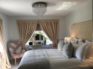 A bed or beds in a room at The Station Guest House