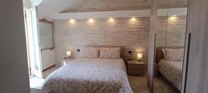 Postel nebo postele na pokoji v ubytování Attico VistaLago - Centro città Verbania