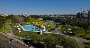 an overhead view of a park with a swimming pool at KOZYGURU Redfern Lovely 2 Bedroom Terrace 1x FREE Parking NRE005 in Sydney