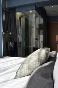 a bed with two pillows sitting on top of it at HIDDEN BANK: DIAMONDS in Plovdiv