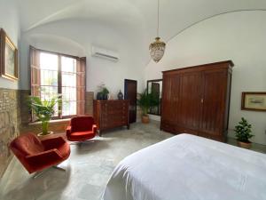 Postel nebo postele na pokoji v ubytování Casa Palacio Ánima