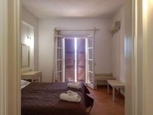 Postel nebo postele na pokoji v ubytování MIRABELLO HOTEL APARTMENTS