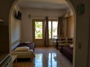 Postel nebo postele na pokoji v ubytování MIRABELLO HOTEL APARTMENTS