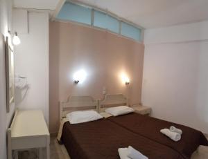 Postel nebo postele na pokoji v ubytování MIRABELLO HOTEL APARTMENTS