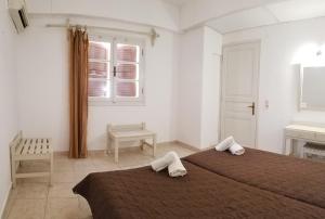 Postel nebo postele na pokoji v ubytování MIRABELLO HOTEL APARTMENTS