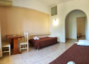 Postel nebo postele na pokoji v ubytování MIRABELLO HOTEL APARTMENTS