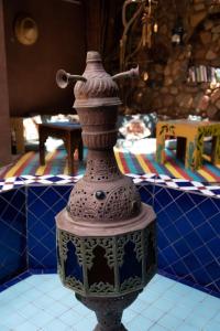 a vase sitting on top of a table at Alf Leila Boutique Hotel in Dahab