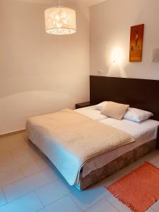Кровать или кровати в номере Solar Apartments