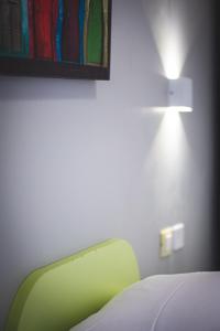 A bed or beds in a room at 3 Rooms 3 Bathrooms - Lovely Apartment close the Vatican