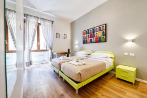 A bed or beds in a room at 3 Rooms 3 Bathrooms - Lovely Apartment close the Vatican