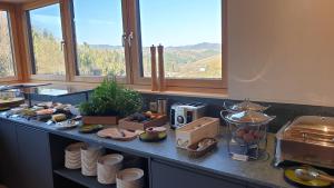 a kitchen with a counter with food on it at Landgut am Pößnitzberg in Leutschach