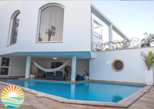 a villa with a swimming pool and a hammock at סוויטת החמה in Eilat +9 photos
