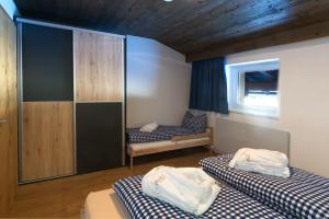 Łóżko lub łóżka w pokoju w obiekcie Appartements Wolf