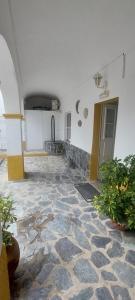 a room with a stone floor in a building at Guesthouse da Vila in Mourão +22 photos