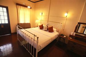 Postel nebo postele na pokoji v ubytování Bandarawela Hotel