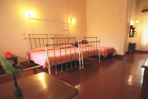 Postel nebo postele na pokoji v ubytování Bandarawela Hotel