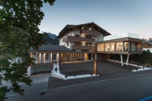 a large house with a lot of windows at ''die Bergerin'' | Appartements Schladming in Schladming