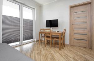 Televízia a/alebo spoločenská miestnosť v ubytovaní Urban Jungle - Vera Apartment