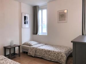 Katil atau katil-katil dalam bilik di Appartements Maisons Bleues