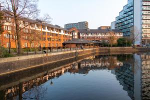 
a large body of water with buildings at Copthorne Hotel Manchester in Manchester
