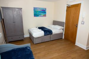 A bed or beds in a room at Alexander Apartments Studios