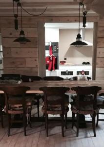 a kitchen with a large wooden table and chairs at Chalet de vacaciones Tartera-Prats i Sansor in Prats i Sansor +3 photos