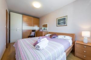 Postel nebo postele na pokoji v ubytování Penthouse Apartment Marija