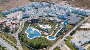 an aerial view of a resort with blue and white buildings at Oceanica by Smir Park luxury apartment Marina Smir in M'diq