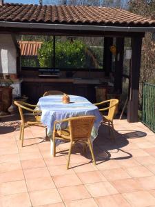 a table and chairs sitting on a patio at villa de charme in Monoblet