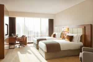 เตียงในห้องที่ InterContinental Doha The City by IHG