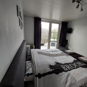 En eller flere senge i et værelse på CosyHuis(j)e