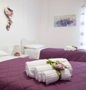 A bed or beds in a room at Il mare in città. Appartamento vista mare