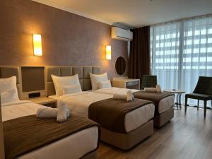 Postel nebo postele na pokoji v ubytování Hotel Kanzler + 37 fotografií