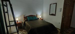 A bed or beds in a room at Rollo Campillo