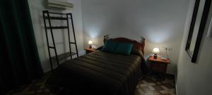 A bed or beds in a room at Rollo Campillo