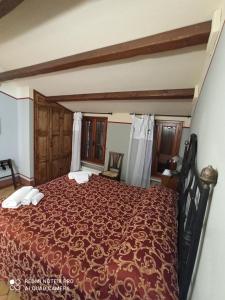 Ένα ή περισσότερα κρεβάτια σε δωμάτιο στο Albergo Diffuso Borgo Montemaggiore