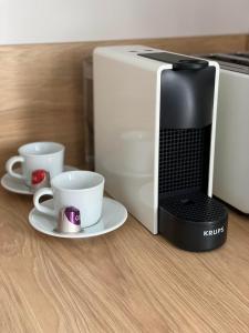 Príslušenstvo na prípravu kávy alebo čaju v ubytovaní Apartament Narcyzowa