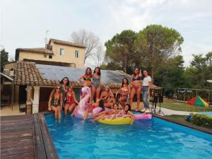 a group of women in the swimming pool at Casale Valentini in Fermo