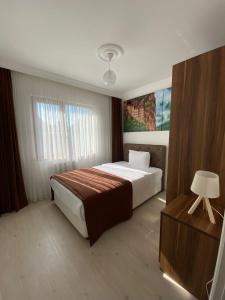 Postel nebo postele na pokoji v ubytování Yaman Suite Apart