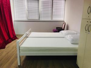Ένα ή περισσότερα κρεβάτια σε δωμάτιο στο Bowling Hostel